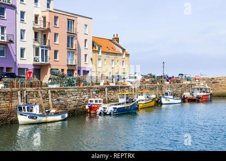 Fishing boats in the harbour at high tide at St Andrews, Fife, Scotland UK Stock Photo