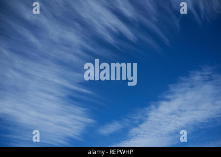 Cloud formations in blue sky over the South Devon coast in Spring.  Beesands, UK Stock Photo