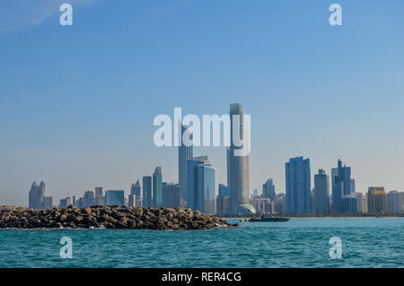 Abu Dhabi city skyline along Corniche beach taken from a boat in UAE Stock Photo