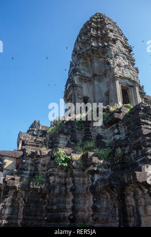 On the second level, looking up at one of the main temple towers, part of the Bakan (main temple), Angkor Wat, Siem Reap, Cambodia Stock Photo
