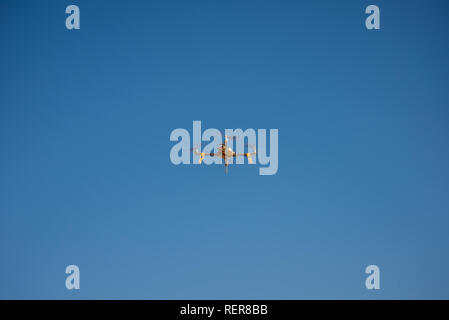 one small drone with blue sky on background. Stock Photo