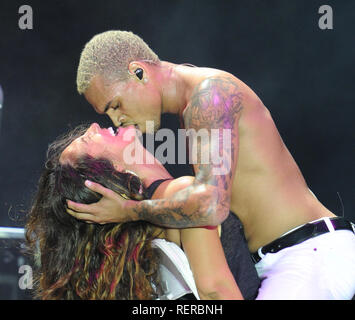MIAMI, FL - MAY 28:  Chris Brown makes one fans day as he sticks his tounge in her mouth and bites her as he performs at the 5th anniversary of the Best Of The Best 'Spring Fest ' concert at at Bicentennial Park, Produced by South Florida's premier music and lifestyle promotions companies, Rocker's Island and XO Management. Christopher Maurice 'Chris' Brown (born May 5, 1989) is an American R&B singer, songwriter, dancer, and actor. on May 28, 2011 in Miami,  Florida.  People:   Chris Brown Stock Photo