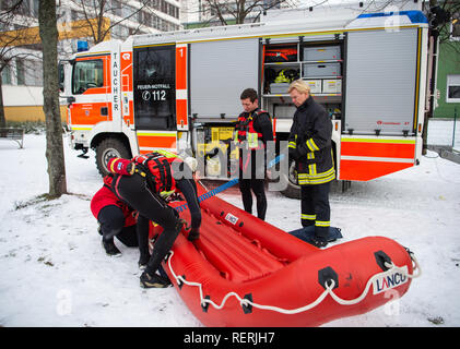 23 January 2019, North Rhine-Westphalia, Düsseldorf: Firefighters prepare a special lifeboat for ice rescue exercises. Photo: Christophe Gateau/dpa Stock Photo