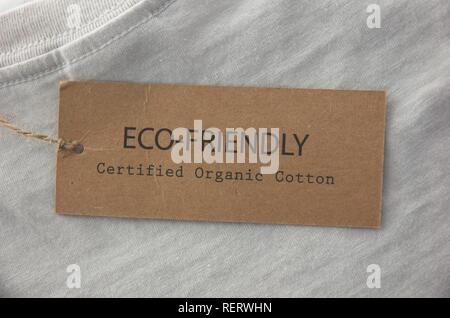 Label on T-shirt stating product is eco-friendly and made from organic cotton Stock Photo