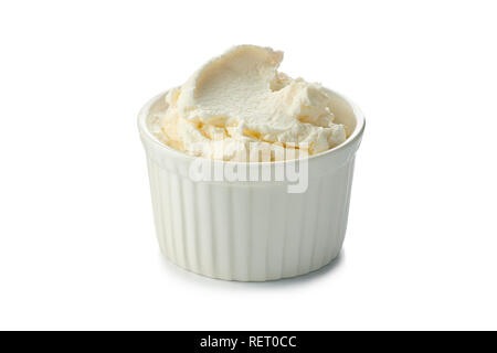 Fresh cream cheese in  bowl on white Stock Photo