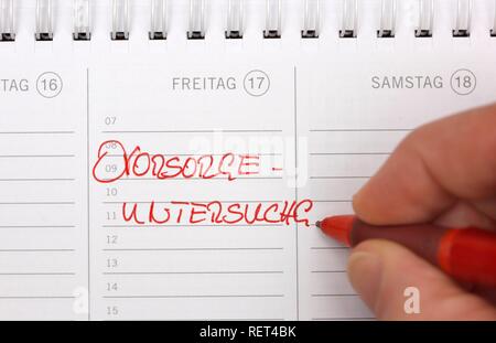 Entry in a private calendar, preventive examination appointment Stock Photo