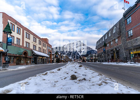 Banff, Alberta Canada - Jan 21, 2019: View of Banff Avenue, a popular tourist destination in the Canadian Rockies, filled with gift shops and restaura Stock Photo