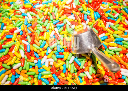 Assorted candy covered licorice with metal spoon Stock Photo