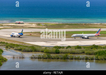 Montego Bay, Jamaica - March 27 2015: Spirit Airlines and American Airlines aircraft preparing for departure from Sangster International Airport