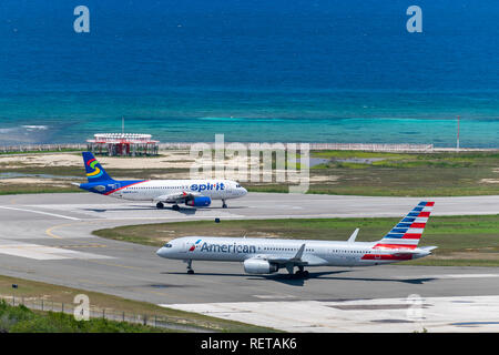 Montego Bay, Jamaica - March 27 2015: Spirit Airlines and American Airlines aircraft preparing for departure from Sangster International Airport