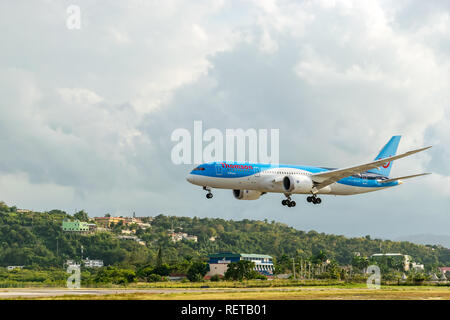 Montego Bay, Jamaica - February 18 2015: Thomson Airways (TUI) boeing aircraft landing at the Sangster International Airport in Montego Bay, Jamaica Stock Photo