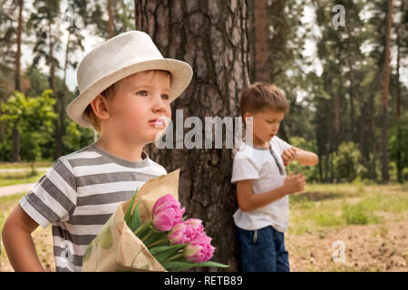 Guy waiting for his dating, date. Boy looking at watch on hand check the time. Punctuality,appointment. Concept for managing time for organization of  Stock Photo