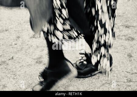 Monochrome. Feet in clogs, Grimsby folk dancing group The Herring Gals celebrate Wassail at the Skidbrooke Cyder Company, Lincolnshire, England. Stock Photo