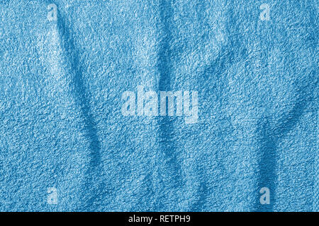 Blue towel on a beige wooden background Stock Photo