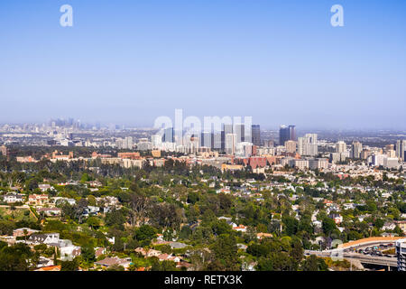 Aerial view towards the skyline of Century City commercial district; the downtown area skyscrapers visible in the background; residential neighborhood Stock Photo