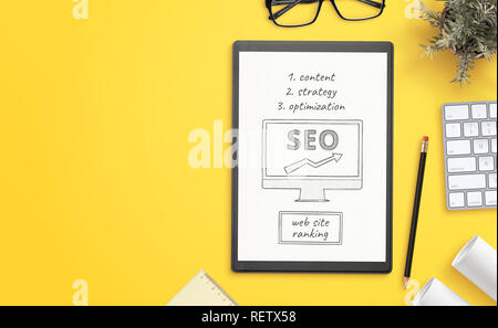 Search engine optimization goals sketch on paper. Office desk with copy space beside. Hero, header image. Stock Photo