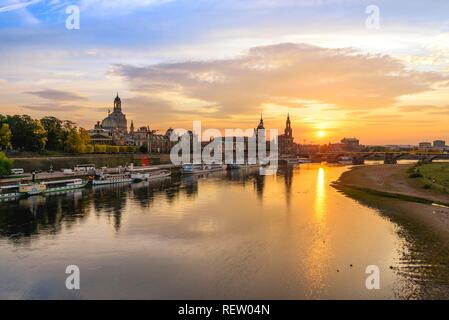 Sunset from the Carola Bridge with view of Augustus Bridge, Terrace Bank, Hofkirche, Residenzschloss, Church of Our Lady, Stock Photo