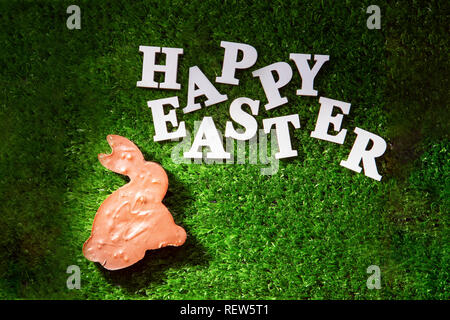 Lettering Happy Easter, laid out on the grass. Stock Photo