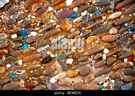 Cobblestone pavement and blue glass, close up Stock Photo