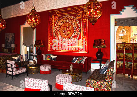 Antique furniture and big lamps in the hall, red interior Stock Photo