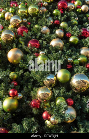 Christmas ball ornaments on outdoor tree Stock Photo