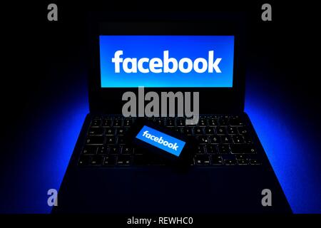 Smartphone with logo Facebook on keyboard, icon cybercrime, computer crime, data protection, Germany Stock Photo