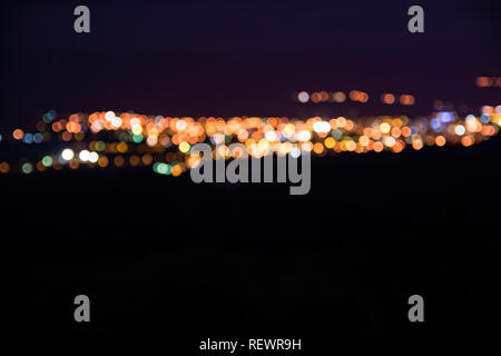 Yellow and orange bokeh abstract background, night blurry effect. Pirot city in Serbia, near Old Mountain Stock Photo
