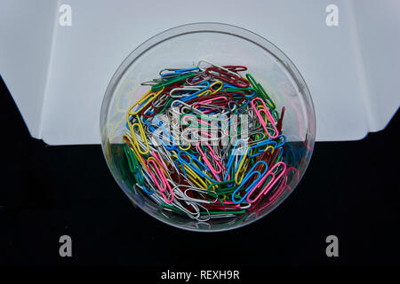 colourfull paperclips with a black and white background Stock Photo