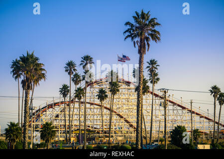 July 8, 2017 Santa Cruz/CA/USA - The Giant Dipper Roller coaster in Santa Cruz Beach Boardwalk amusement park at sunset, California Stock Photo