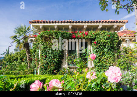 December 23, 2017 San Simeon / CA / USA - Casa del Sol cottage covered in bougainvillea, Hearst Castle Stock Photo