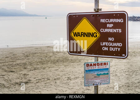 December 24, 2017 Morro Bay / CA / USA - 'Warning Recurring RIP currents No Lifeguard on Duty' posted sign together with other recommendations Stock Photo