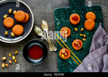 Flat-lay of pishtachios caramel cookies on vintage background Stock Photo