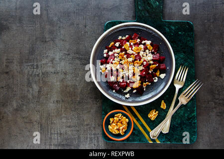 Flat-lay of salad with roasted beetroot, walnut and feta cheese Stock Photo