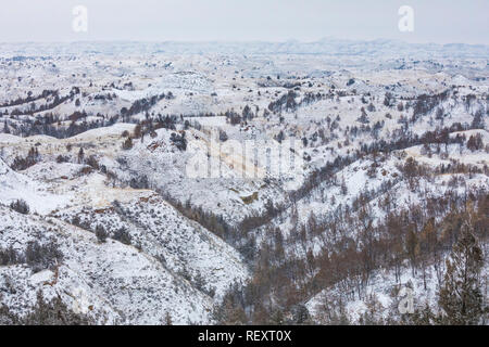 Snow-covered badlands in November in the South Unit of Theodore Roosevelt National Park, North Dakota, USA Stock Photo