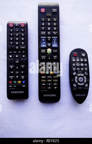 TV, Blu ray and Hi-Fi System Remote Controls Isolated on White Stock Photo