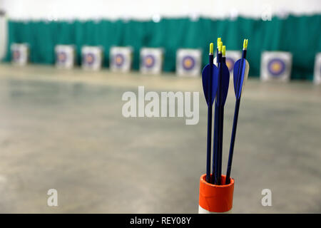 Youth archery arrows with targets at range Stock Photo