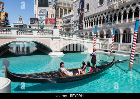 Las Vegas, Nevada, USA - September 1, 2017: Tourists enjoying ride in gondola at Grand Canal at The Venetian Resort Hotel and Casino.  This luxury hot