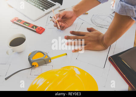 Architect or engineer working on blueprint in office, architectural concept Stock Photo
