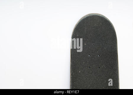 Front top of a skateboard deck with grip tape and bolt holes on white background Stock Photo