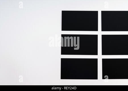 Photo of black blank business cards on a white background. Template for ID. Top view Stock Photo