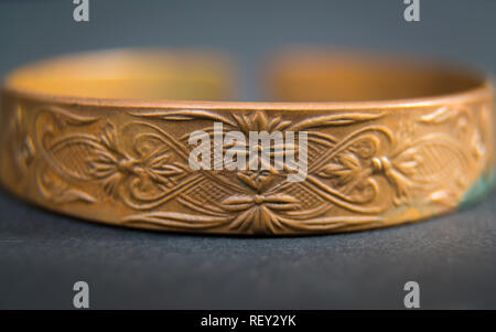 Detail of old vintage hand bracelet on dark background. Hand jewellery accessory Stock Photo