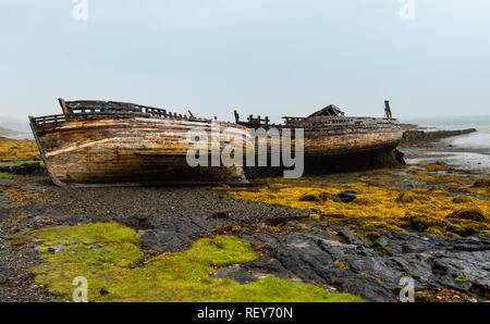 Shipwrecked fishing boats on the Scottish isle of Mull Stock Photo