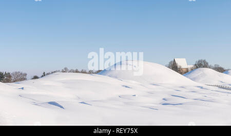 Old Uppsala (Gamla Uppsala) Royal burial mounds in the winter. Uppsala, Sweden. Scandinavia. Stock Photo