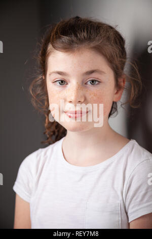Portrait of pretty Scottish 10 year old girl with freckles. Stock Photo