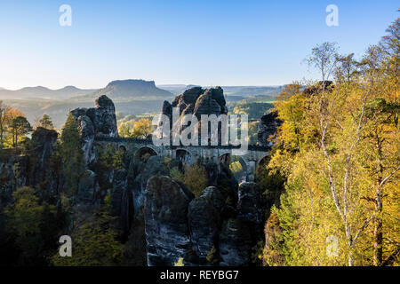 Landscape in the National Park Sächsische Schweiz with rock formations, Bastei bridge and trees Stock Photo