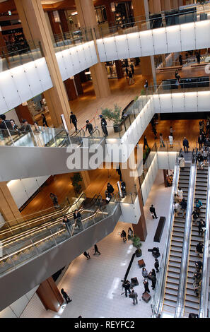 Visitors make their way around the Tokyo Midtown shopping and office complex, which opened in Tokyo on Friday, 30 Mar., 2007.  Photographer: Robert Gi Stock Photo