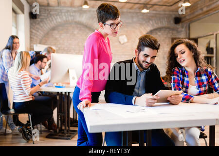 Business people and architects collaborating on project Stock Photo