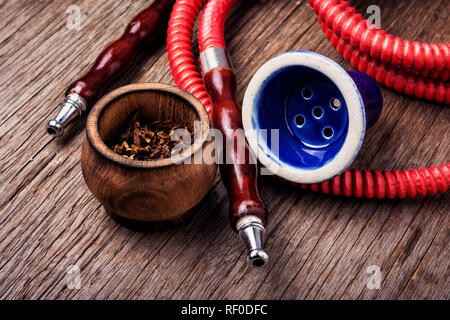 Oriental fashion hookah.Smoking eastern shisha.Tobacco in snuffbox and hookah Stock Photo