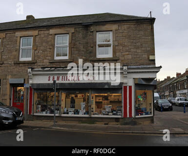 S and M Electricals shop Amble on Queen Street. A small independent shop    Amble is a small town on the north east coast of Northumberland Stock Photo