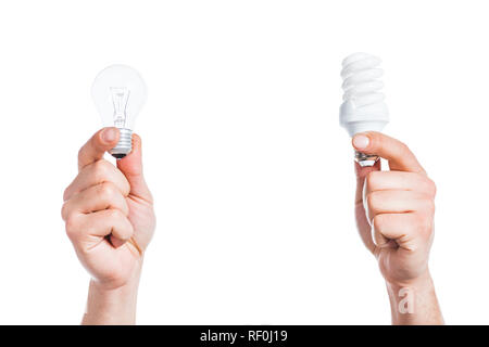cropped view of  male hands holding led and fluorescent lamps isolated on white, energy efficiency concept Stock Photo